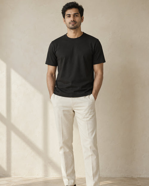 the signature tee in black, worn, front view